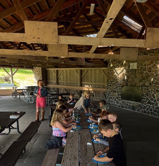 Students at an outdoor picnic table